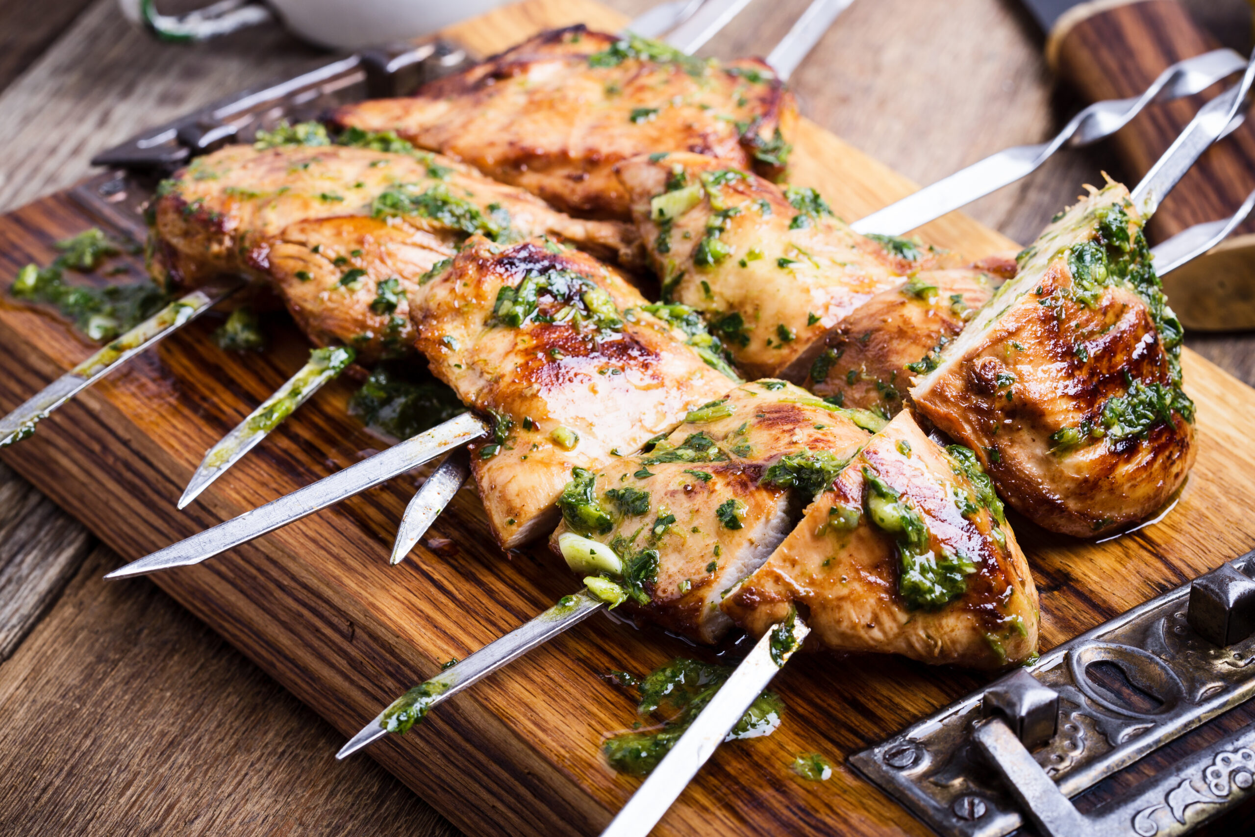 Grilled chicken skewers with chimichurri sauce